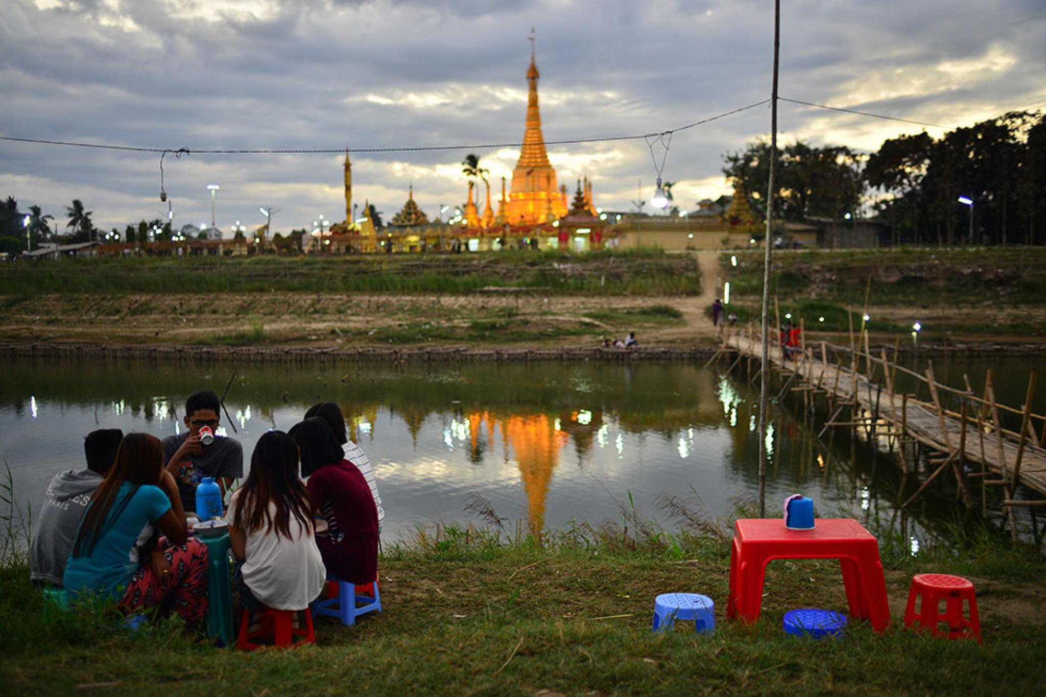 Young people gathering at lakeside in Myanmar