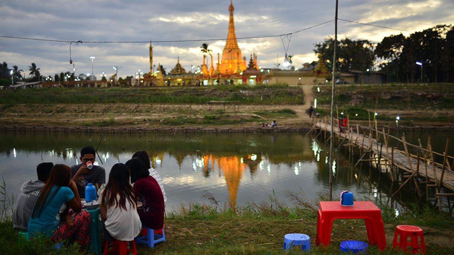 Young people gathering at lakeside in Myanmar