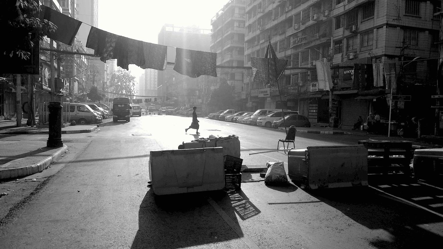Person walking across Myanmar street personwalkingmyanmarstreet.jpg